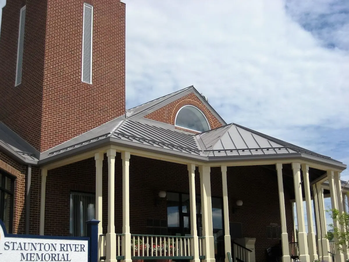 Skilled roofing craftsmen working on a residential roof in Bucksville